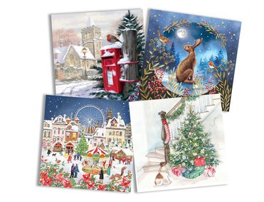 A selection of festive cards layed out on a white background.