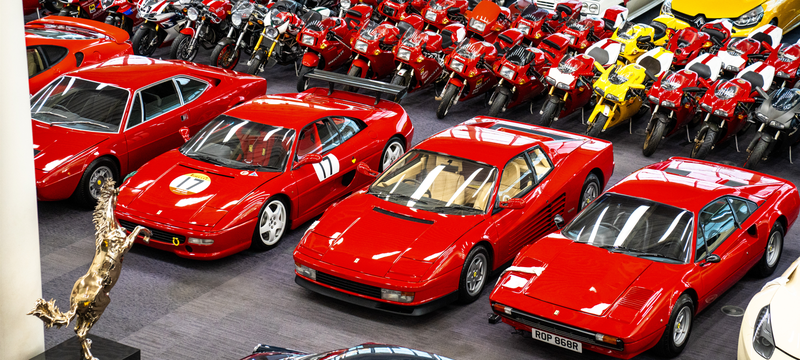 Rows of red classic cars and motorbikes