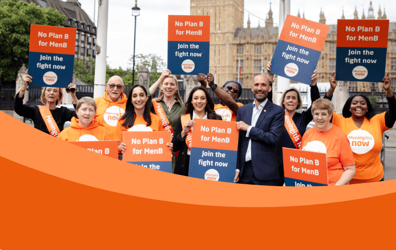 A group of individuals in orange t-shirts and sashes holding placards outside of government buildings that say 'No Plan B for Men B, Join the fight now' with a Meningitis Now logo at the bottom.
