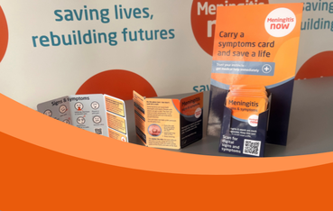 Photo showing hard copies of Meningitis Now's signs and symptoms cards