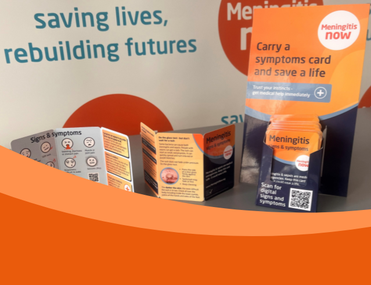 Photo showing hard copies of Meningitis Now's signs and symptoms cards