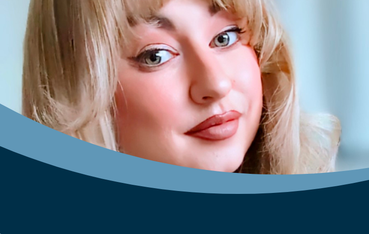 White woman with blonde hair in close up photo looking directly at camera
