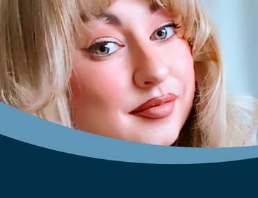 White woman with blonde hair in close up photo looking directly at camera