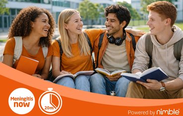 Group of four student-aged people of different ethnicities smiling at each other