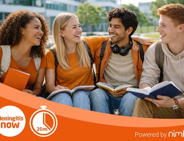 Group of four student-aged people of different ethnicities smiling at each other